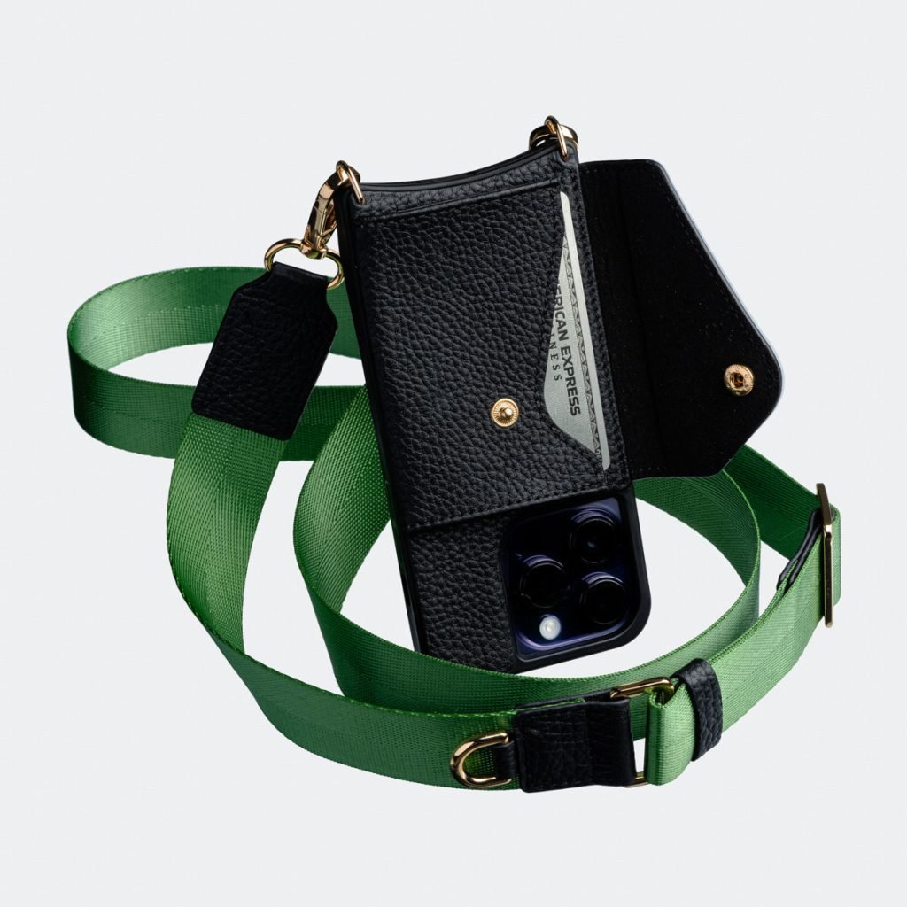Black Bandolier-style leather crossbody phone case featuring a built-in wallet and secure card slots.